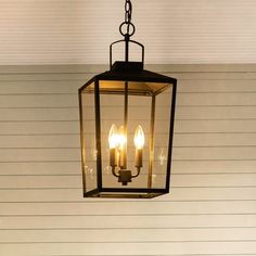 This hanging lantern features a fresh take on the classic lantern shape. The pendant light is equally sturdy and stylish, including clear tempered glass panes, matching its textured black finish in refined distinction. Three 60W bulbs (not included) rest in a black candelabra, while a square finial connects the lantern to a simple chain. This lantern's open bottom lets light shine on your entryway or front porch. Plus, its wet rating means it's suitable for outdoor conditions no matter the weath Porch Pendant Light, Black Candelabra, Outdoor Pendant Light, Front Porch Lighting, Glass Panes, Porch Light, Simple Chain, Outdoor Pendant Lighting, Outdoor Pendant