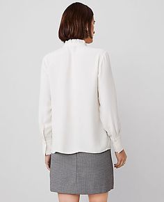 Topped with a pretty ruffle neck, our mixed media blouse is a modern romantic. Stand ruffle collar. Long sleeves with button cuffs.,Hit:26" long,Imported:Imported,Fit:Slim,Fabrication:100% Polyester,Garment Care:Machine Washable Ruffle Neck Blouse by Ann Taylor Size regular - XL Winter White Women's Split, Neck, Long, Sleeve, Blouse, Tops, 100%, Polyester, Machine, Washable Classic Ruffled Collar Blouse For Fall, Classic Ruffled Collar Top For Fall, Feminine Tops With Ruffle Hem For Work, Long Sleeve Tops With Ruffle Hem For Work, Classic Fall Top With Ruffled Collar, Fall Workwear Blouse With Ruffle Hem, Classic Fall Tops With Ruffled Collar, Workwear Tops With Ruffled Collar, Formal Ruffle Sleeve Blouse For Fall