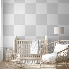 a baby's room with a crib and rocking chair