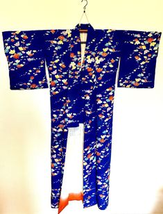 Vintage silk kimono from the 1970s.  this is a beautiful original kimono from Japan.  it is silk.  it has a floral pattern.  it is a long and flowing garment. a complimentary silk belt will be include. as to be expected with vintage items there may be small stains.  there is a small stain on the lining of this kimono. Silk Kimono, Vintage Silk, Dress Clothes For Women, 1970s, Floral Pattern, Vintage Items, Dress Outfits, Silk, Womens Dresses