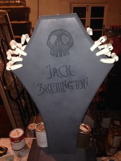 a jack skellingon tombstone with candles on it