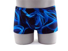 "Designed with a vibrant look sure to turn heads,this men's swimsuit lights up the beach or pool in refreshing style,this eye-catching stretch nylon square cut swimsuit for men stands out for all the right reasons. MADE IN USA PLEASE NOTE: All print fabric designs swimsuits varies, no two are alike. Drawcord waist 7\" Inch Side seams 3/4 inch waist elastic 3/8 inch leg elastic Center seam front pouch" Swimsuit For Men, Swimsuit Blue, Fabric Designs, Blue Swimsuit, Mens Swim Trunks, Square Cut, Boxer Shorts, Mens Swimwear, Swim Trunks