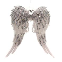 an angel wing ornament hanging from a chain on a white background with silver glitters