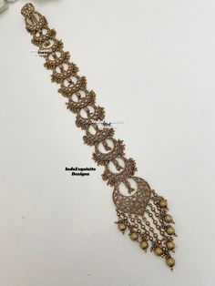 Polki Choti/Braid choti/Indian bridal choti/polki hair Accessories/Indian wedding/Polki hair accessories/polki braid jewelry/antique gold End to end length - 16 inch  All items are shipped from Brampton, Ontario, Canada. If you need your item by a certain day, please reach out to us for express delivery option before placing the order so that we can update the shipping for you. We kindly request to consider minor variations in colors, shades, textures as pictures displayed may slightly vary from Bohemian Kundan Necklace With Intricate Design For Wedding, Bohemian Kundan Necklace For Wedding And Festivals, Bohemian Gold Bridal Necklace With Cutdana, Bohemian Kundan Temple Necklace For Wedding, Gold Bohemian Tikka With Meenakari, Bohemian Style Temple Necklace With Meenakari For Wedding, Bohemian Temple Necklace With Meenakari For Wedding, Bohemian Tikka For Wedding And Festive Occasions, Bohemian Wedding Tikka With Stone Work