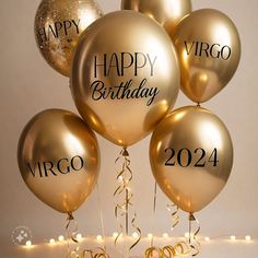 golden balloons with happy virgo year written on them are surrounded by confetti and streamers