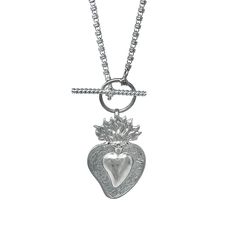 Based on a DelBrenna family design, our Flaming Heart pendant represents our passion for our craft. We love beauty, fashion, and sharing our creativity with you. This pendant calls you to open your heart and share your wonderful self with the world! Pendant in 925 silver with DelBrenna’s Signature Rhodium Finish. It is 2 1/4” in height and 1 1/2” wide. Its bail slides onto all DelBrenna chains up to 5mm. Chain sold separately. Unique Silver Heart Pendant Necklace, Unique Sterling Silver Necklace With Heart Charm, Sterling Silver Heart Charm Jewelry, Unique Silver Heart Charm Necklace, Silver Spiritual Heart Charm Necklace, Unique Silver Heart Necklace With Charm, Spiritual Sterling Silver Heart Charm Necklace, Unique Heart-shaped Sterling Silver Necklace, Spiritual Silver Heart Charm Necklace