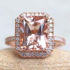 This classic, handmade Radiant Morganite Halo Ring begins with a stunning, genuine AAA morganite. This is part of our Helena Collection, which features a halo of diamonds around the center stone and half-way down the shank, as well as under the main stone to give you sparkle from every angle! A cathedral shank raises the center stone so that a matching wedding band can sit flush. Center stone: AAA Peachy-Pink Morganite, Radiant Cut, average 10x8mm and 3.50 carats. Side stones: 68 natural, white Mason Ryder, Morganite Halo Ring, Pink Engagement, Cathedral Ring, Morganite Pendant, Full Eternity Ring, Morganite Engagement, Pink Morganite, Morganite Engagement Ring