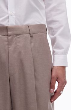 Crisp creases elevate stretch-kissed suit pants that are a sophisticated addition to any office wardrobe. 30 1/2" inseam; 20" leg opening; 12" front rise; 16 1/2" back rise (size 32) Zip fly with hook-and-bar closure Front slant pockets; back welt pockets 84% polyester, 14% viscose, 2% elastane Dry clean Imported Business Casual Slim Fit Wide Leg Pants, Business Casual Wide Leg Slim Fit Pants, Wide Leg Slim Fit Pants For Business Casual, Slim Fit Wide Leg Bottoms For Business Casual, Fitted Tapered Leg Bottoms With Welt Pockets, Fitted Bottoms With Welt Pockets And Tapered Leg, Spring Stretch Business Casual Bottoms, Semi-formal Stretch Bottoms For Spring, Spring Semi-formal Stretch Bottoms