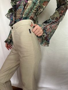 "Vintage high waist beige jeans Istante by Versace. Tight non-stretch denim. Two front pockets. Two pockets on the back. Metal front zipper. Leg is straight. Size 38 tag W.24 L.30, fits like XS Condition 10/10 !NEW with tag! Made in Italy Length- \"/ cm In-Seam- \"/ cm Waist- \"/ cm Hips- \"/ cm 📍 follow the shop on Instagram: @𝚔𝚘𝚛𝚊𝚛𝚎_𝚟𝚒𝚗𝚝𝚊𝚐𝚎 All measurements taken with garment lying flat.  Vintage sizes vary greatly! We recommend comparing measurements with a similar style garment Beige High Waist Flare Jeans For Fall, High Rise Beige Flare Jeans For Spring, Trendy Khaki High-waisted Jeans, Khaki Straight Cargo Jeans, Cream Straight Leg Jeans For Fall, Spring Khaki Jeans With Hip Pockets, Khaki Mid-rise Jeans With Hip Pockets, Chic High Waist Beige Flare Jeans, Chic Beige High-waist Flare Jeans