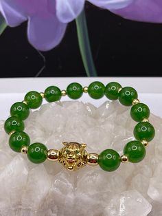 Handmade 10mm high quality grade AAA Canadian green Jade with 18K gold filled lion head. Gold filled 4mm spacers. Made of durable string. Not easy to break. Lead and nickel free. Green Jade Bracelet, Tiffany Bracelets, Jade Bracelet, Lion Head, Green Jade, Natural Ruby, Jade Green, Stainless Steel Bracelet, Fashion Bracelets