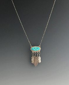 100% handcrafted sterling silver and Royston turquoise statement necklace.  5 silver feathers dangle from bezel set stone and act as tassels. Turquoise Bohemian Jewelry With Feathers, Bohemian Turquoise Jewelry With Feathers, Silver Feather Necklace, Bolo Necklace, Turquoise Statement Necklace, Redwood City, Feather Necklace, Feather Jewelry, Royston Turquoise