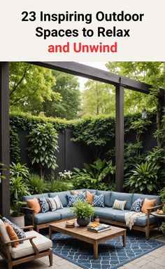 an outdoor patio with blue couches and pillows on the floor, surrounded by greenery