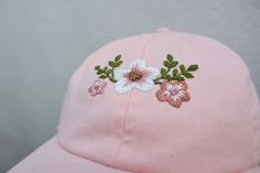 Hand Embroidered Pastel Pink Floral hat. The perfect addition to your Spring/Summer wardrobe this season, every design is hand drawn and hand embroidered onto the hat meaning that each one is individually unique. 🌿 Perfect for everyday wear or makes a great gift. 🌿 One size fits all with an adjustable buckle on the back. 🌿 The cap is 100% cotton embroidered with cotton thread. 🌿 Care instructions - Hand wash warm 30oC. ** Please note that hat colours may differ slightly due to the lighting o Ladies Cap, Hat For Summer, Pink Baseball Hat, Festival Hat, Floral Hat, Embroidered Cap, Embroidered Caps, Panel Hat, Summer Festival