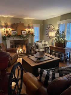 a living room filled with furniture and a fire place under a clock mounted on the wall