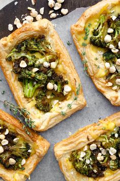 broccoli and cheese puff pastry with pine nuts on the top one is cut in half