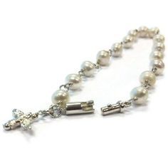 This pearl bracelet created by Jewelry By Carmal is made of: white freshwater pearls, sterling silver: dove charm, spring ring clasp and findings. This bracelet measures 7 1/2 inches in length. View more beaded bracelets: http://www.etsy.com/shop/jewelrybycarmal?section_id=8002918 Pearl is the birthstone for June and the gemstone for the 3rd and 30th Wedding Anniversaries. All of our jewelry arrives wrapped and ready for gift giving! We offer free standard shipping (via USPS) within the United S Wedding Rosary Bracelet With Pearl Charm, Elegant Silver Pearl Bracelet For Baptism, Wedding Pearl Bracelet With 8mm Beads, Elegant Silver Pearl Bracelet For First Communion, Wedding White Gold Pearl Bracelet With Pearl Drop, White Gold Pearl Drop Wedding Bracelet, Silver Pearl Bracelets With 8mm Beads, Elegant Pearl Bracelet For First Communion, Elegant Pearl Rosary Bracelet For Baptism