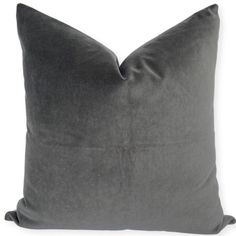 a dark gray pillow on a white background