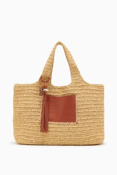 Our Kamari Tote is a refined, everyday bag made all the more elegant thanks to subtle detailing. Hand-woven from natural raffia, it has a roomy interior that’s unlined to maintain its drapey silhouette and has two top handles you can easily slip over your shoulder. A whipstitched-trimmed leather pocket on the outside secures smaller items, while the leather tassel with antique brass ring adds an elevated touch. Composition: 100% Polypropene Pair with the Menorca Maillot to complete the look. Double Handle Bag With Intrecciato Weave For Vacation, Elegant Crochet Bag With Intrecciato Weave In Natural Color, Vacation Bag With Intrecciato Weave And Double Handle, Vacation Bags With Intrecciato Weave And Double Handle, Elegant Crochet Bag With Braided Double Handles, Natural Crochet Bag With Intrecciato Weave, Elegant Woven Leather Crochet Bag For Daily Use, Elegant Woven Leather Beach Bag For Travel, Rectangular Natural Hobo Bag With Intrecciato Weave