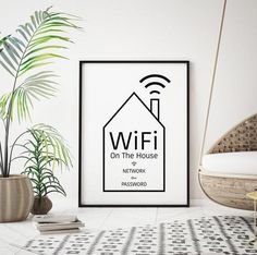 a black and white poster with the words wifi on it next to a potted plant