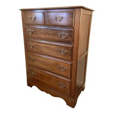 a wooden dresser with many drawers on it