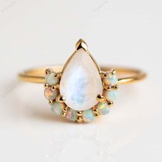 Vintage Pear Shape Moonstone Engagement Ring Rose gold Antique Opal and Moonstone Wedding ring Anniversary gift promise ring Gift For Him Welcome to A1Jewells Experience stunning jewelry which compliments your style everyday, All the items in my shop are hand made items and are crafted by our Master Goldsmith in our workshop, We pay a lot of emphasis on the making of the ring and we always assure you that we will provide best quality products every time toy you, Detailed description of the product Main Stone: Moonstone Main Stone Creation: Natural Main Stone Size: 6x8mm Main Stone Color: Rainbow Main Stone Shape: Pear Secondary Stone : Opal Secondary Stone Shape : Round Secondary Stone Size : 2mm Metal: 925 Sterling Silver Method: Cast Personalization: Possible Occasion: Wedding Style: Art Rose Gold Moonstone Ring, Moonstone Engagement Ring Rose Gold, Opal Promise Ring, Gold Moonstone Ring, Natural Opal Ring, Local Eclectic, Opal Wedding Rings, Ring Opal, Moonstone Engagement