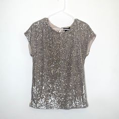 Sequin Top With Nude Lining - Short Sleeves - Back Keyhole With Button Closure Nwt I Accept Reasonable Offers, Use The Offer Button #0019 Elegant Shiny Tops For Night Out, Shiny Tops For Party Season, Glamorous Silver Shiny Tops, Glamorous Silver Shiny Top, Silver Embellished Party Top, Metallic Shimmer Blouse For Party, Party Metallic Embellished Tops, Silver Shimmer Top For Party, Holiday Shimmer Blouse For Night Out