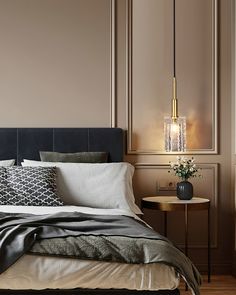 a bedroom with a bed, nightstands and lamps on the side tables in front of it