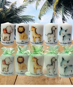 the baby shower candles are decorated with animals