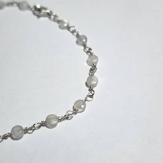 Sterling Silver hand beaded link bracelet. Faceted White Moonstone 4mm coin shape beads with a spring ring clasp. This stunning simple dainty bracelet has a nice sparkle that flashes as it reflects light with its tiny facets. Perfect for a bride, bridesmaid or as i do, everyday wear.  This bracelet as it is is 6 inches but id be happy to adjust it to your wrist at no extra charge up to 8 inches.  Contact me to customize the fit.  All orders will be given tracking numbers so you can track your order.  Shipped within 48 hours Delicate Silver Round Bracelet, Adjustable Faceted Round Crystal Bracelet, Adjustable Faceted Crystal Bracelet, Adjustable Round Faceted Bracelet, Adjustable Faceted Bracelet, Dainty Hypoallergenic Chain Bracelet With Round Beads, Silver Hypoallergenic Rosary Bracelet, Handmade Dainty Rosary Bracelet With Round Beads, Dainty Handmade Rosary Bracelet With Round Beads