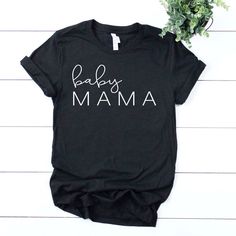 "This pregnancy announcement listing is for one bella canvas unisex pregnancy T-shirt. This shirt is the perfect shirt for your baby announcement or pregnancy reveal. Its also the perfect new mom gift, baby shower gift or maternity gift. + This shirt is a unisex shirt, not a maternity shirt. Unisex shirts have a \"boyfriend fit\" which works well for pregnant women in their first and second trimesters. Order your normal size for a casual looser fit, size down if you would like a slimmer fit. Als Maternity Graphic Tee With Letter Print, Maternity T-shirt With Graphic Print And Relaxed Fit, Maternity Family Matching T-shirt With Graphic Print, Family Matching Cotton Shirt For Gender Reveal, Maternity Graphic T-shirt With Crew Neck, Maternity Graphic Tee With Crew Neck, Casual Maternity T-shirt With Funny Text, Black Family Matching T-shirt For Gender Reveal, Cotton T-shirt For Gender Reveal, Relaxed Fit