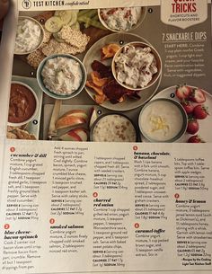 the recipe book is open to show several different types of food in bowls and on plates