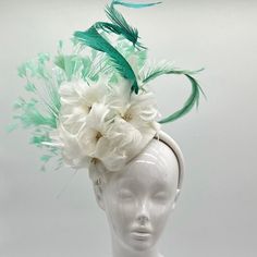 Handmade by Featured Milliner of The Kentucky Derby Museum 2023 & 2024! Cream feathery flowers with mint green feathers  Attaches with headband.  Not taking customs this year--Derby 150 is going to be massive and mom life keeps me running! However, happy to suggest pieces that will coordinate with your outfit. If you don't love the way this attaches to your head--message me!  I can swtich *most* pieces to your preference. Clip, Headband OR Elastic Cord  NOTE: Heavier pieces with extravagant florals etc require the stability of a headband. NO RETURNS/EXCHANGES due to nature of product (special occasion and head wear). Not all screens/lighting are created equal. Make sure you are happy with the color match before ordering! If you have any concerns, let me know--here to help. Just say the wor Summer Races Ostrich Feather Headpiece, Summer Ostrich Feather Mini Hats For Races, Formal Mini Hats With Feather Trim For Spring, Summer Races Mini Hat With Ostrich Feathers, Summer Mini Hats With Ostrich Feathers For Races, Summer Race Day Mini Hats With Ostrich Feathers, Ostrich Feather Mini Hat For Royal Ascot Races, Ostrich Feather Mini Hats For Races, Royal Ascot Mini Hats With Ostrich Feathers For Races