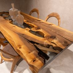 a table made out of wood with chairs around it and a vase sitting on top