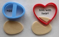 two cookie cutters shaped like hearts with the words egg and trim with heart