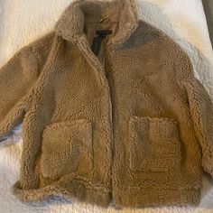 Fluffy Brown Soft Jacket, Very Warm , Never Worn Brown Sherpa Outerwear For Winter, Cozy Khaki Outerwear With Pockets, Brown Sherpa Outerwear With Pockets, Brown Sherpa Outerwear For Cold Weather, Brown Sherpa Outerwear With Fleece Lining, Brown Sherpa Outerwear For Fall, Beige Sherpa Outerwear For Fall, Beige Fur Coat With Pockets For Cold Weather, Cozy Beige Sherpa Outerwear