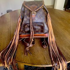 New With Tags Vintage Louis Vuitton Montsouris Backpack Western Style With Tassels. Bought At Wyld Blue In Aspen. Never Used. Western Purse Storage, Louis Vuitton Crossbody Bag Western, Louis Vuitton Montsauris, Upcycled Louis Vuitton Purse, Upcycled Louis Vuitton Bag, Fringe Louis Vuitton Backpack, Louis Vuitton Fringe Purse, Revamped Louis Vuitton Western, Louis Vuitton Fringe Crossbody Bag