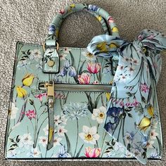 Adorable Floral Handbag With Bow. Top Handle Or Crossbody. Nearly Brand New. Blue Top Handle Shoulder Bag For Spring, Spring Floral Print Double Handle Shoulder Bag, Floral Print Double Handle Shopping Bag, Spring Gift Bag With Detachable Strap, Spring Gift Bags With Detachable Strap, Blue Tote Satchel For Spring, Green Floral Print Rectangular Bag, Elegant Top Handle Bag With Floral Print, Spring Gift Rectangular Satchel