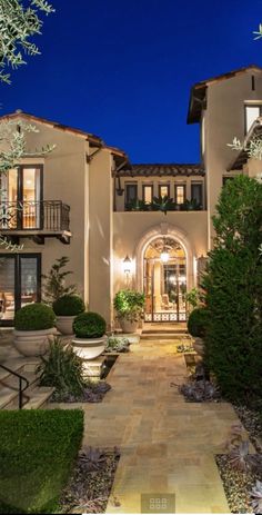 a large house that is lit up at night