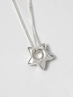 • 18" 925 sterling silver curb chain • 925 sterling silver star charm • Pendant measures 15mm • Made with recycled metals Star Necklace Silver, Star Charm Necklace, Silver Wolf, Demi Fine Jewelry, Charm Pendant Necklace, Engraved Items, Recycled Metal, Mellow Yellow, Star Charms