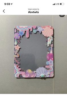 an image of a photo frame that is made out of paper and some other things