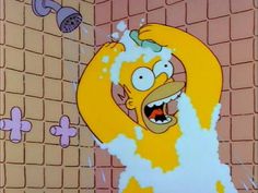 the simpsons character is taking a shower in his bathroom