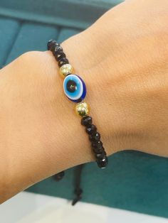 Evil eye one size fits all crystal bracelet Elegant Adjustable Jewelry With Diamond Eyes, Trendy Adjustable Crystal Jewelry, Elegant Beaded Evil Eye Bracelet With Round Beads, Adjustable Spiritual Crystal Jewelry, Adjustable Round Crystal Bracelets, Adjustable Evil Eye Jewelry Bracelet, Adjustable Round Evil Eye Bracelet, Elegant Round Beaded Bracelets With Evil Eye, Elegant Beaded Evil Eye Bracelet Gift