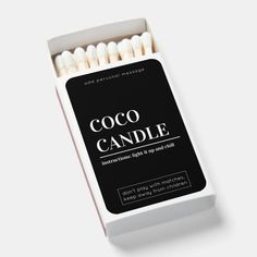 an open box of coco candle matches on a white background