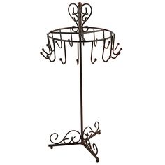 a metal rack with four hooks on it