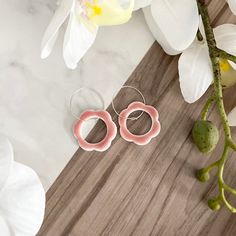 These beautiful handmade flower earrings are crafted from polymer clay with hypoallergenic sterling silver earring hoops, and finished with a pink ceramic-effect resin glaze. They make a lovely gift for the earring fan in your life. If you would like these earrings made in a different colour please feel free to contact me and I will do my best to source or mix the perfect shade for you. This polymer clay jewellery is handmade and therefore there may be slight variations or minor imperfections in each unique piece. Colours may vary slightly compared with the photographs. To care for your handmade jewellery please keep away from moisture and avoid contact with cosmetics such as make up, creams and perfumes. Clean very gently with a damp sponge. Thank you very much for looking at my Etsy shop Pink Sterling Silver Hypoallergenic Hoop Earrings, Pink Hypoallergenic Sterling Silver Hoop Earrings, Pink Sterling Silver Hypoallergenic Flower Earrings, Pink Hypoallergenic Sterling Silver Flower Earrings, Hypoallergenic Pink Flower Earrings In Sterling Silver, Pink Flower-shaped Hoop Earrings For Gift, Pink Flower Shaped Hoop Earrings As Gift, Pink Flower Shaped Hoop Earrings For Gift, Pink Sterling Silver Flower Earrings Nickel Free