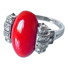 Extremely elegant and rare to find original Art Deco period ring by Boucheron. The ring is centred with a fine quality medium salmon colour natural coral cabochon embellished by 8 rows of millegrain diamonds set in a geometric design and domed by 4 cone set diamonds. These cone set diamonds are a very particular detail about this elegant ring. Signed Boucheron Paris, numbered 6147, with assay mark for France to the outer band, this ring is in a very good wearable condition and can be resized upo Art Deco Diamond Cabochon Rings, Art Deco Diamond Rings With Cabochon, Salmon Colour, French Jewelry, Deco Originale, Natural Coral, Art Deco Period, Salmon Color, Deco Jewelry