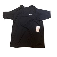 The Nike Essential Swim Shirt Offers Sun Protection To Help Guard Against Uv Rays While You're Training Outdoors. Knit Fabric Gives This Shirt Natural Stretch For A Comfortable Fit, While Sweat-Wicking Technology Helps To Manage Moisture. Black Moisture-wicking Short Sleeve Shirt, Nike Crew Neck Moisture-wicking Shirt, Nike Moisture-wicking Crew Neck Shirt, Nike Crew Neck Shirt With Moisture-wicking, Casual Black Crew Neck Short Sleeve Shirt, Nike Short Sleeve Relaxed Fit Shirt, Nike Relaxed Fit Short Sleeve Shirt, Black Moisture-wicking Relaxed Fit Shirt, Black Moisture-wicking Shirt With Relaxed Fit