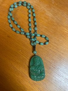 "Beautiful Vintage Chinese Carved stone, likely Jade, Hard Stone Buddha Pendant Bead Necklace. The pendant measures 2.25\"high x 1 1/4\" wide x 3/8\" in depth and the beaded becklace is 26\" and slips over the head. Very, very good condition. No chips, cracks or repairs" Traditional Jade Necklaces For Meditation, Traditional Jade Necklace For Meditation, Jade Gemstone Beads Jewelry For Meditation, Jade Amulet Jewelry For Meditation, Carved Round Beads Jewelry For Meditation, Jade Amulet Necklace With Natural Stones, Traditional Jade Jewelry For Meditation, Spiritual Jade Jewelry With 108 Beads, Jade Amulet Necklaces For Healing