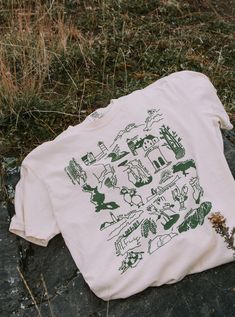 Our tribute to the nature in Maine! This design features lighthouses, major mountains, beloved wildlife, & 15+ other beautiful sites from the Allagash to Acadia. Let it remind you of the places you've been and inspire you to see the rest!  These will ship within 2 business days of ordering. If combined with a made-to-order item, we will default to shipping when your entire order is ready This listing has a measurement chart (please scroll through the photos); you can also reference any reviews a Maine Nature, Baxter State Park, Cape Elizabeth, Nature Shirts, Beautiful Sites, Color Free, Ivory Color, You've Been, Granola