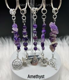 amethyst bracelets are displayed on a stand